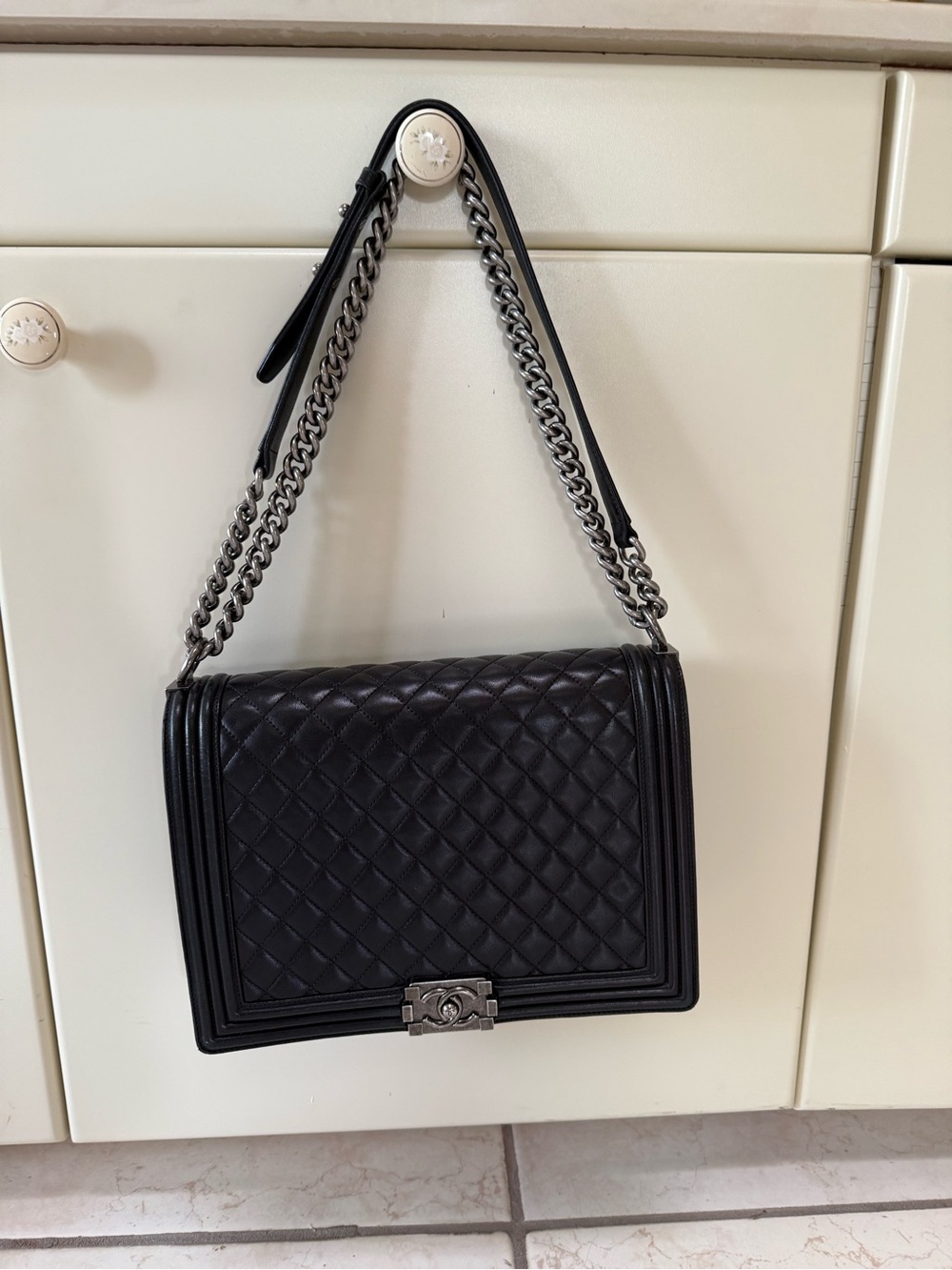 CHANEL Black Quilted Leather Boy Shoulder Bag with Silver Chain